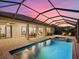 Relaxing screened-in pool and spa area with patio furniture at 16203 Tradewind Ter, Lakewood Ranch, FL 34211
