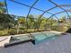 Relaxing screened pool and spa with lush landscaping at 16203 Tradewind Ter, Bradenton, FL 34211