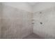 Spacious shower with tile surround and built-in shelves at 16203 Tradewind Ter, Lakewood Ranch, FL 34211