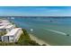 Aerial view of waterfront property with boats and lush landscape at 1751 Beach Rd # 404, Englewood, FL 34223