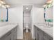 Updated bathroom with dual vanities and a walk-in shower at 1751 Beach Rd # 404, Englewood, FL 34223