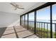 Bedroom with water views and a ceiling fan at 1751 Beach Rd # 404, Englewood, FL 34223
