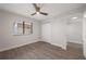 Bright bedroom with wood-look floors and ample closet space at 1751 Beach Rd # 404, Englewood, FL 34223
