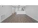 Open concept living room and kitchen area with hardwood floors at 1751 Beach Rd # 404, Englewood, FL 34223