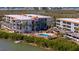 Community pool with ample deck space for lounging at 1751 Beach Rd # 404, Englewood, FL 34223
