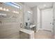 Modern bathroom features a walk-in shower with glass enclosure and built-in bench at 17530 Northwood Pl, Bradenton, FL 34202