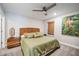 Comfortable bedroom with king-size bed and tropical artwork at 17530 Northwood Pl, Bradenton, FL 34202