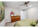 Bedroom with dresser, king-size bed, and access to bathroom at 17530 Northwood Pl, Bradenton, FL 34202