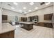 Modern community kitchen with granite counters at 17530 Northwood Pl, Bradenton, FL 34202