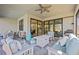 Covered lanai with comfortable seating and view of pool at 17530 Northwood Pl, Bradenton, FL 34202