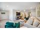 Open loft area with sectional sofa and large TV at 17530 Northwood Pl, Bradenton, FL 34202