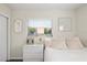Bedroom featuring a queen bed and a window with blinds at 1909 23Rd W Ave, Bradenton, FL 34205