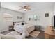 Bedroom with king bed, chair, and window coverings at 1909 23Rd W Ave, Bradenton, FL 34205