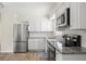 Modern kitchen featuring stainless steel appliances and granite countertops at 1909 23Rd W Ave, Bradenton, FL 34205