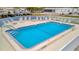 Community swimming pool with lounge chairs at 2107 Palma Sola Blvd # 82, Bradenton, FL 34209