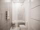 Clean bathroom with hexagon tile and bathtub at 2194 Fruitville Rd, Sarasota, FL 34237