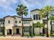 Tan two story home with palm trees at 2194 Fruitville Rd, Sarasota, FL 34237