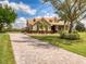 A long brick driveway leads to a beautiful home at 22623 Morning Glory Cir, Bradenton, FL 34202