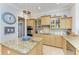 Well-equipped kitchen with granite island and ample cabinet space at 22623 Morning Glory Cir, Bradenton, FL 34202