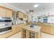 Large kitchen with an island, granite countertops and stainless steel appliances at 22623 Morning Glory Cir, Bradenton, FL 34202