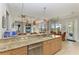 Island kitchen with granite countertops and stainless steel appliances at 22623 Morning Glory Cir, Bradenton, FL 34202