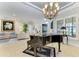 Bright living room with a grand piano and access to backyard at 22623 Morning Glory Cir, Bradenton, FL 34202