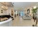Open living space showcasing a piano and access to a pool view at 22623 Morning Glory Cir, Bradenton, FL 34202