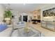 Elegant living room featuring a piano and ample natural light at 22623 Morning Glory Cir, Bradenton, FL 34202