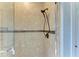 Large walk-in shower with beige tile and bronze fixtures at 22623 Morning Glory Cir, Bradenton, FL 34202