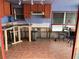 Kitchen needing renovation with tiled floors at 2601 Gulf N Dr # B16, Bradenton Beach, FL 34217