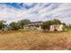 Spacious backyard with a screened patio and beautiful landscaping at 27425 Jones Loop Rd, Punta Gorda, FL 33982