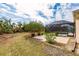Landscaped backyard with a view of the pool area at 27425 Jones Loop Rd, Punta Gorda, FL 33982