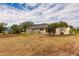 View of the home's exterior and expansive backyard at 27425 Jones Loop Rd, Punta Gorda, FL 33982