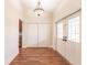 Bright entryway with hardwood floors and double doors at 27425 Jones Loop Rd, Punta Gorda, FL 33982