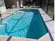 Inviting pool with a screened enclosure and stamped concrete decking at 27425 Jones Loop Rd, Punta Gorda, FL 33982