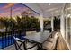 Outdoor patio with dining table and chairs, overlooking the pool at 3015 Avenue E, Holmes Beach, FL 34217