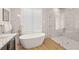 Spa-like bathroom featuring a freestanding tub and a large shower at 3015 Avenue E, Holmes Beach, FL 34217