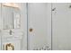 Clean bathroom with a walk-in shower and marble vanity at 3015 Avenue E, Holmes Beach, FL 34217