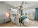 Main bedroom with a four poster bed and ocean view at 3015 Avenue E, Holmes Beach, FL 34217
