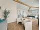 Spacious main bedroom with sitting area and ensuite bathroom at 3015 Avenue E, Holmes Beach, FL 34217
