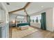 Spacious main bedroom with hardwood floors and large windows at 3015 Avenue E, Holmes Beach, FL 34217