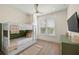 Cozy bedroom with twin-over-twin bunk bed, green accent wall, and TV at 3015 Avenue E, Holmes Beach, FL 34217