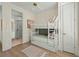Charming bedroom with twin-over-twin bunk bed and access to bathroom at 3015 Avenue E, Holmes Beach, FL 34217