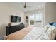 Comfortable bedroom with king-size bed, dark dresser, and large window with blinds at 3015 Avenue E, Holmes Beach, FL 34217