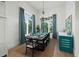 Bright dining room with a large table and unique chandelier at 3015 Avenue E, Holmes Beach, FL 34217