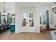 Elegant entryway with double French doors and a view of the backyard at 3015 Avenue E, Holmes Beach, FL 34217