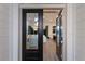 Open entryway with glass double doors leading into a spacious living area at 3015 Avenue E, Holmes Beach, FL 34217