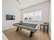 Game room featuring a pool table and a bar area at 3015 Avenue E, Holmes Beach, FL 34217