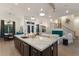 Modern kitchen with large island and marble countertops at 3015 Avenue E, Holmes Beach, FL 34217