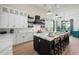 Stunning kitchen island with white quartz countertop and black base cabinets at 3015 Avenue E, Holmes Beach, FL 34217